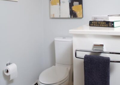 Contemporary Dual-Flush Toilet in Alcove