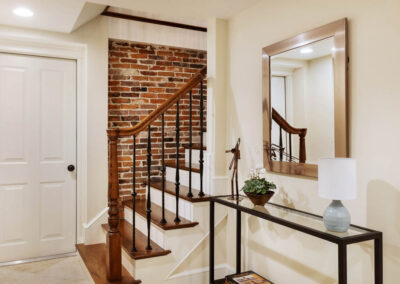 Garage Entry & Kitchen Stairs with Exposed Brick